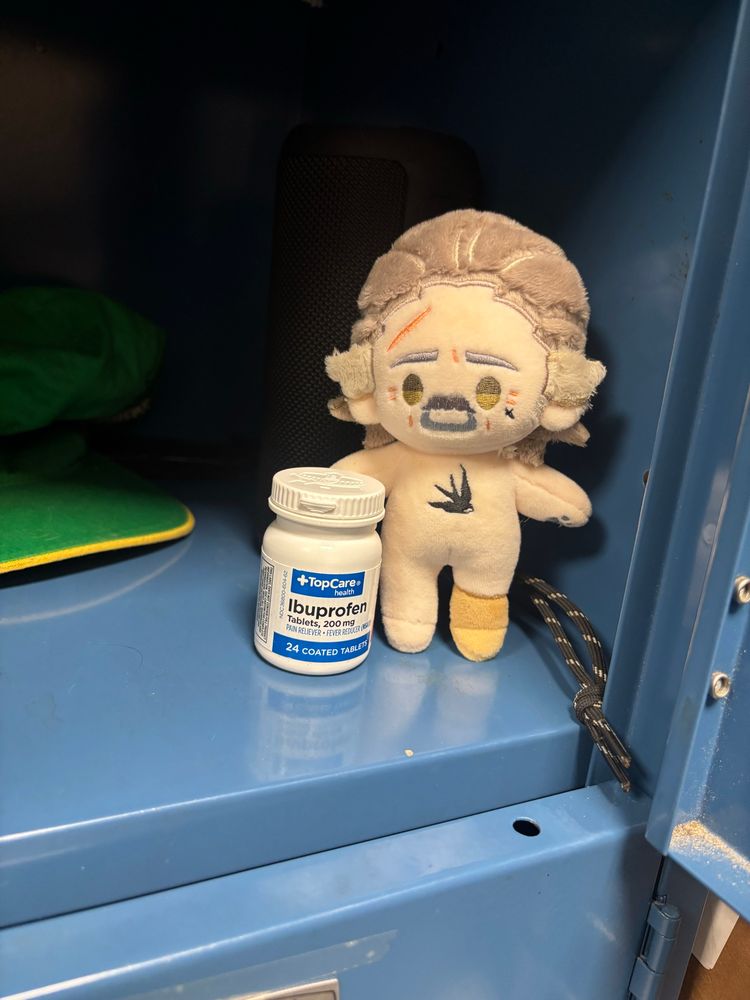 little izzy doll guarding the ibuprofen in my locker 