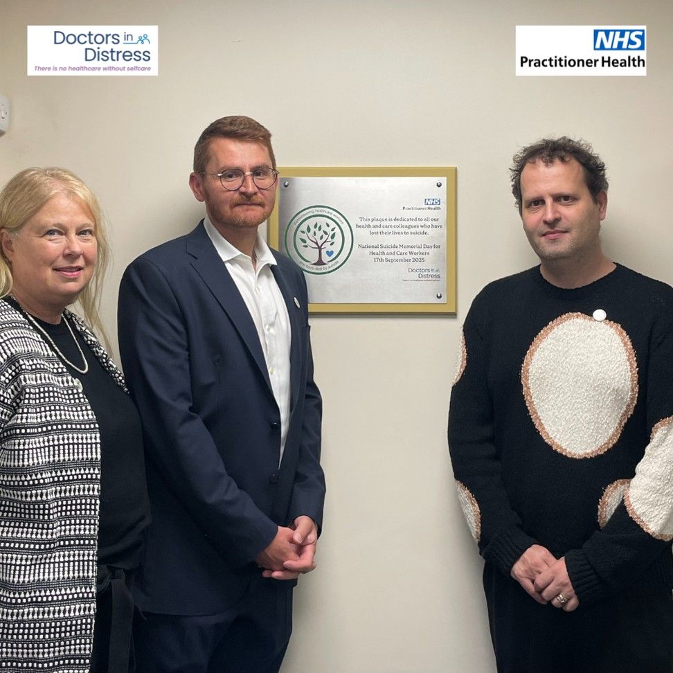 Lucy Warner, CEO of PH, Dr Zaid Al-Najjar, Medical Director of PH, and Dr Adam Kay standing next to the memorial plaque in Docklands Medical Centre.
