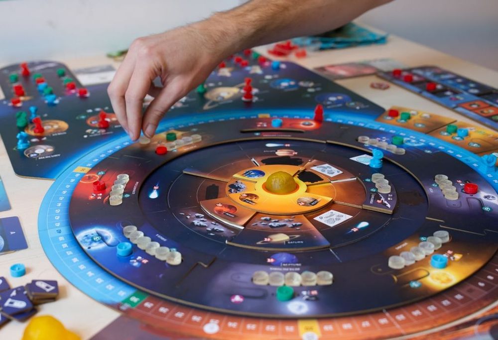 Photo of the board game Seti, showing the main game board, & game pieces.