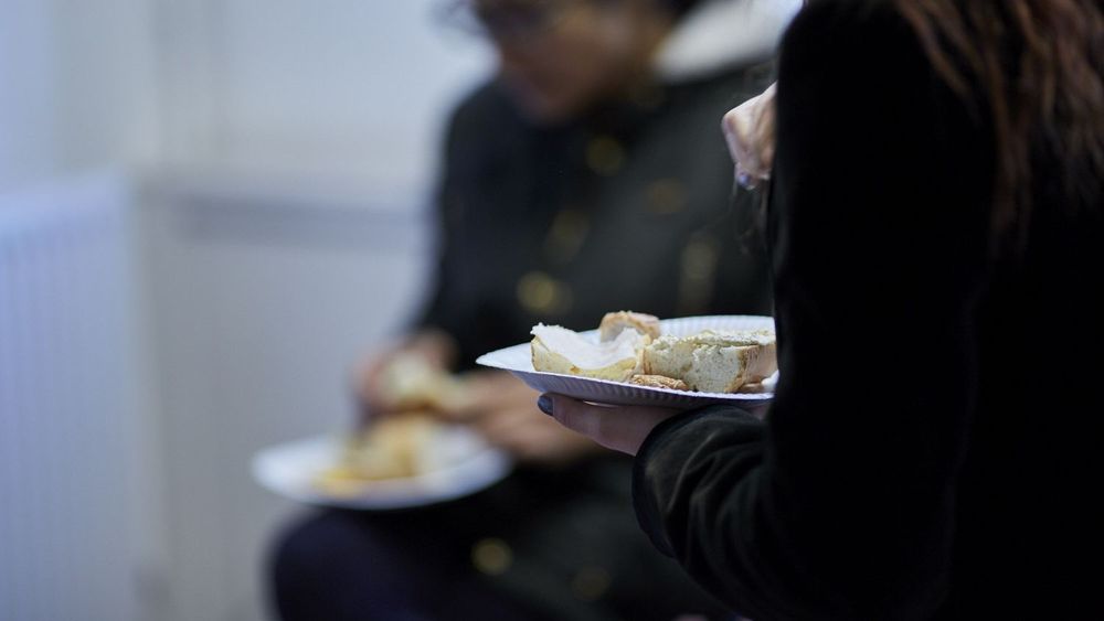Two King's students eating lunch in the Strand Chaplaincy