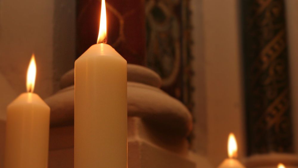 Lit candles in the College Chapel, Strand