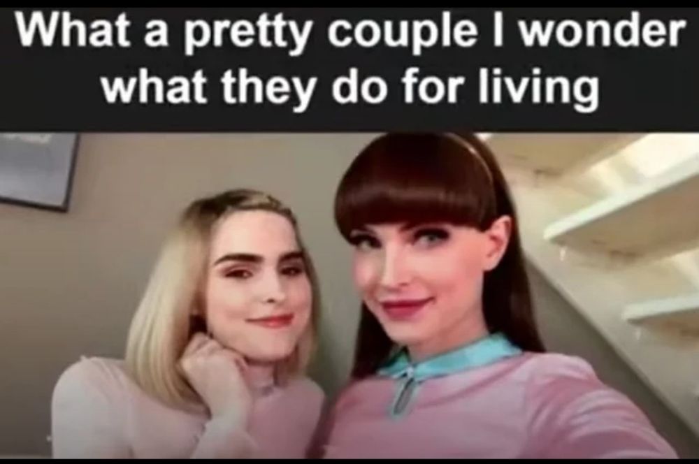 A picture of Ella Hollywood and Natalie Mars standing together with the words "What a pretty couple I wonder what they do for a living" above them.