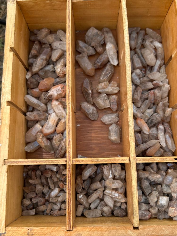 quartz crystals in a wooden box 