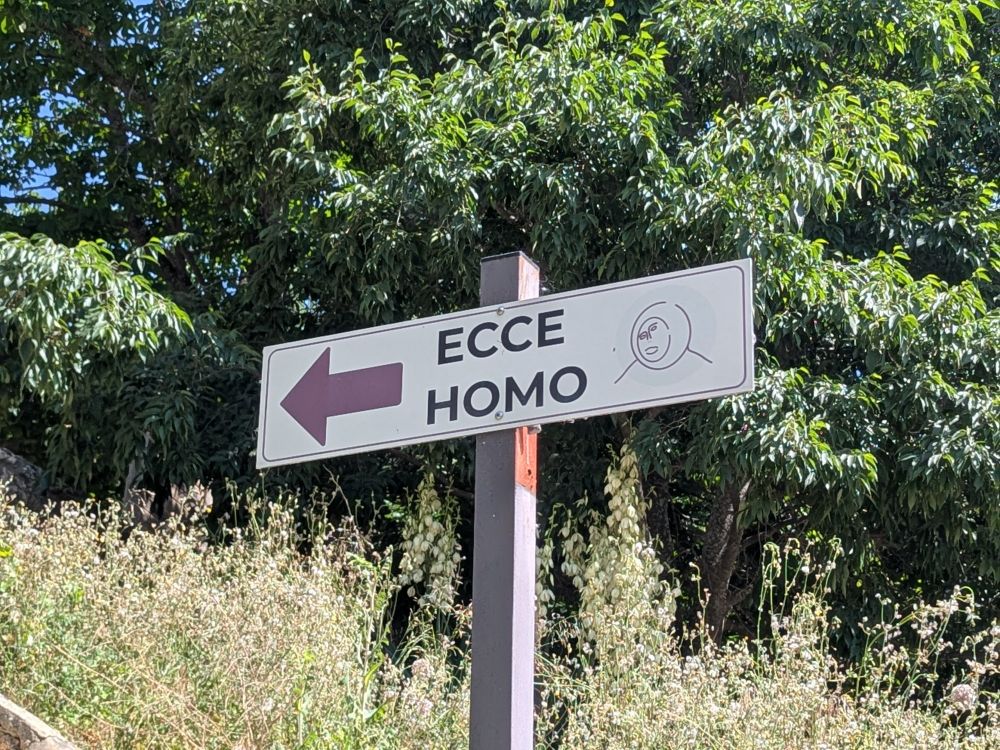 Sign for Ecce Homo with outline drawing of the restored version 
