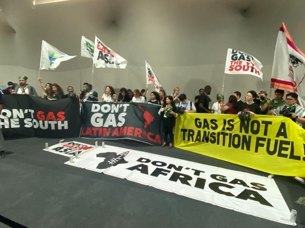 Photo of people protesting  unchecked gas expansion in the Global South at COP 30 in Belem, Brazil.
