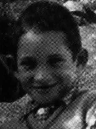 Close-up of a smiling young boy.