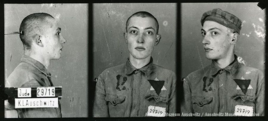 A mugshot registration photograph from Auschwitz. A man with a shaved head wearing a striped uniform photographed in three positions (profile and front with bare head and a photo with a slightly turned head with a hat on). The prisoner number is visible on a marking board on the left.