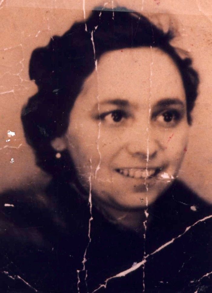 Vintage portrait of a smiling woman with short, curly hair
