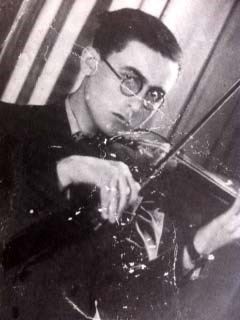 Black and white photo of a man playing a violin.