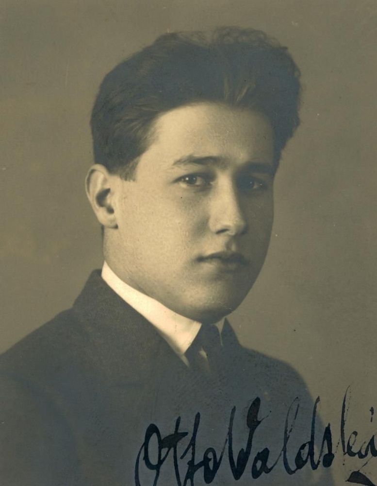 Vintage black and white portrait of a man, featuring a close-up of an individual in formal attire.