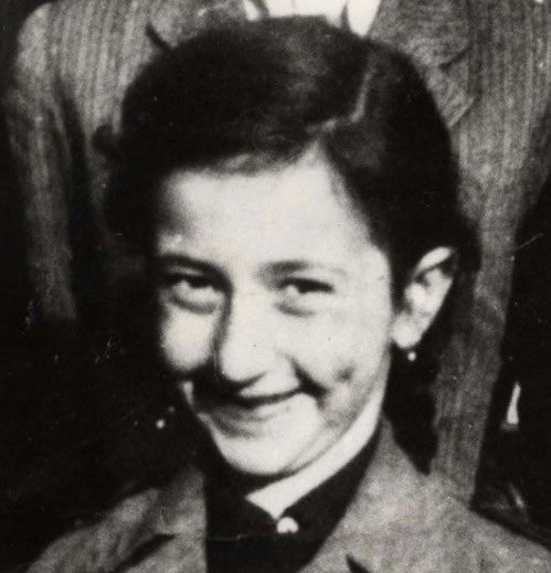 Black and white photo of a girl smiling.
