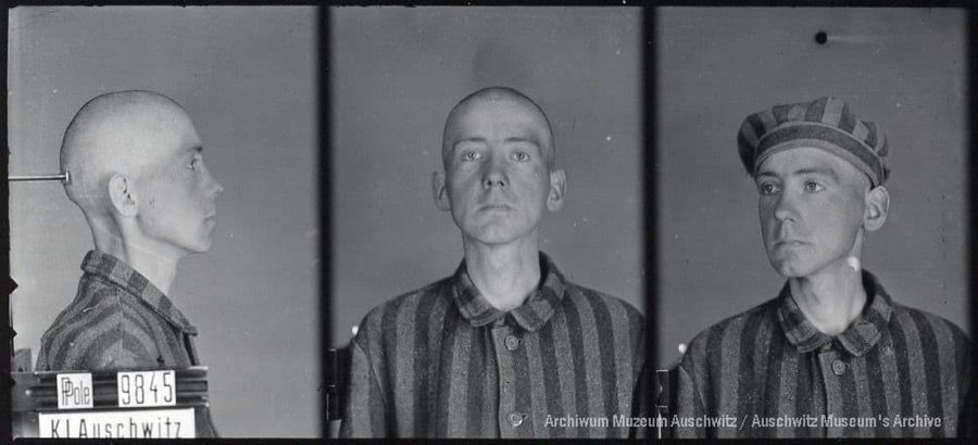 A mugshot registration photograph from Auschwitz. A man with a shaved head wearing a striped uniform photographed in three positions (profile and front with bare head and a photo with a slightly turned head with a hat on). The prisoner number is visible on a marking board on the left.