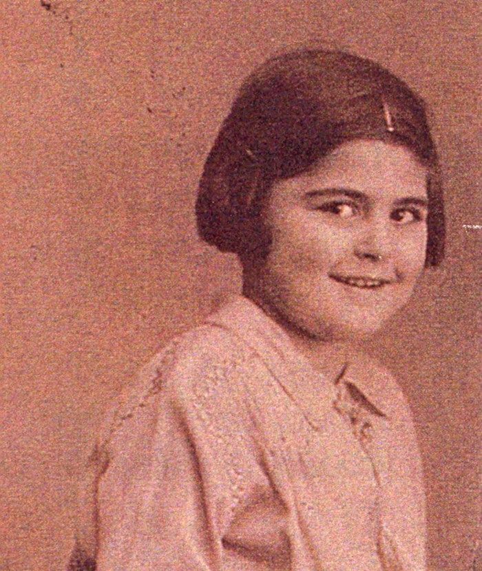 Vintage portrait of a smiling young girl wearing a style blouse