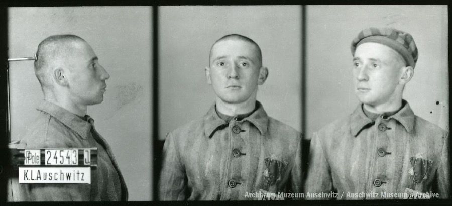 A mugshot registration photograph from Auschwitz. A man with a shaved head wearing a striped uniform photographed in three positions (profile and front with bare head and a photo with a slightly turned head with a hat on). The prisoner number is visible on a marking board on the left.