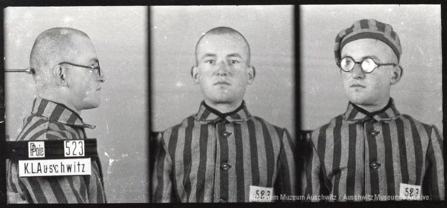 A mugshot registration photograph from Auschwitz. A man with a shaved head wearing a striped uniform photographed in three positions (profile and front with bare head and a photo with a slightly turned head with a hat on). The prisoner number is visible on a marking board on the left.