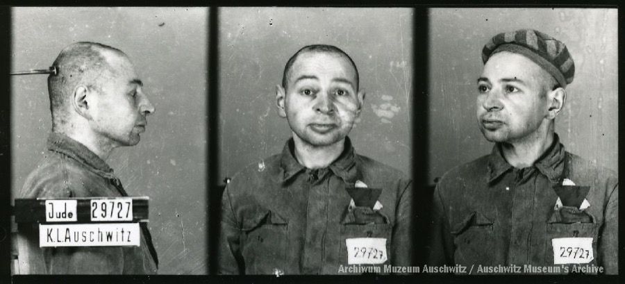 A mugshot registration photograph from Auschwitz. A man with a shaved head wearing a striped uniform photographed in three positions (profile and front with bare head and a photo with a slightly turned head with a hat on). The prisoner number is visible on a marking board on the left.