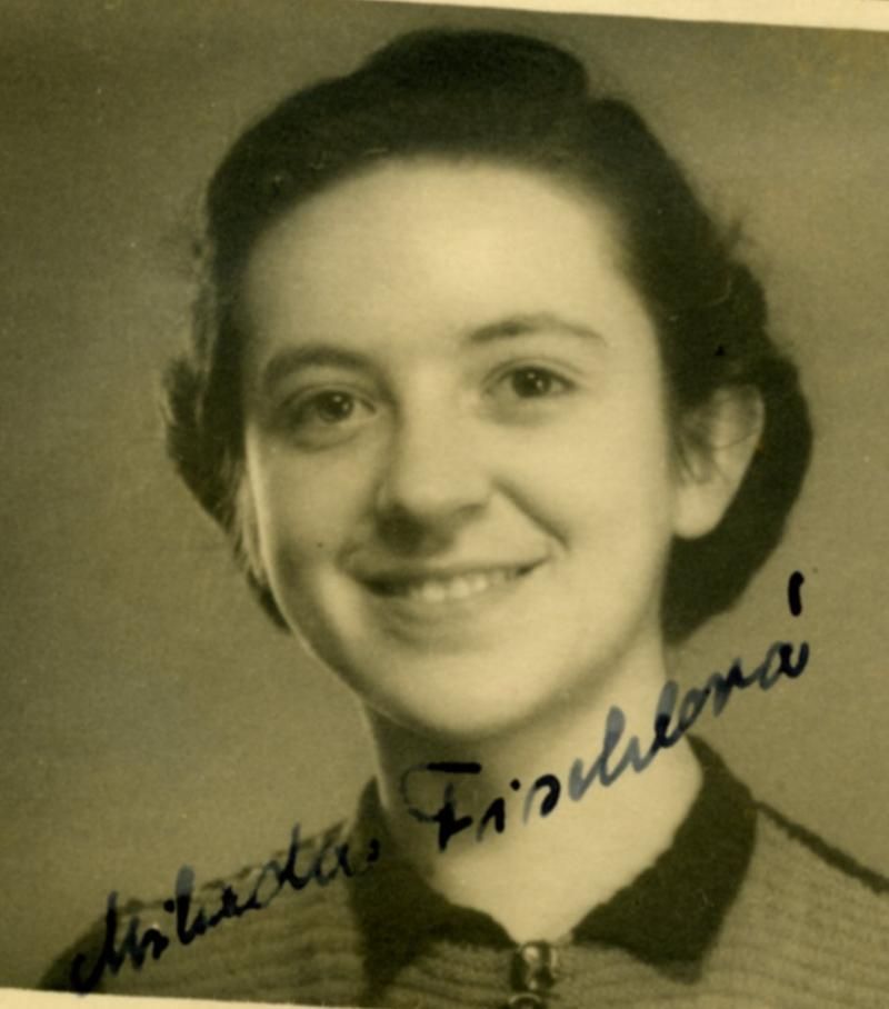 A portrait ID photo of a young smiling woman.