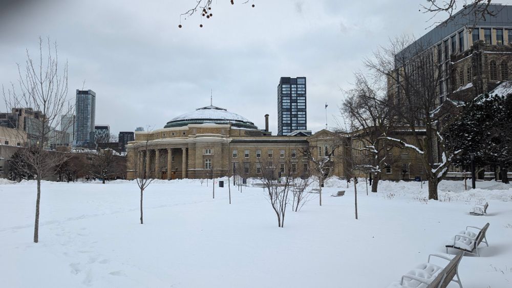 Simcoe Hall with its round domed roof in the snow. 