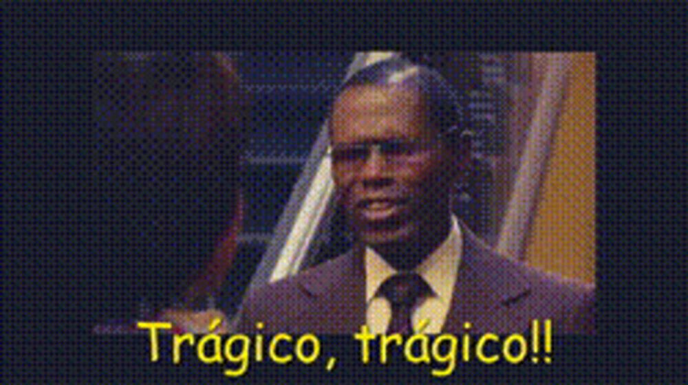 a man in a suit and tie says " tragico " in yellow