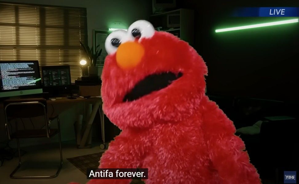 Screenshot from The Daily Show's interview with Elmo, where Elmo is saying "antifa forever!"