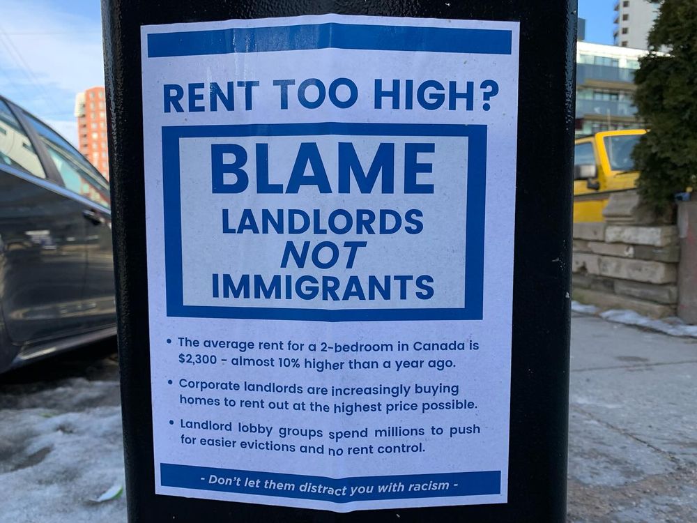 Wheatpasted posted that says RENT TOO HIGH? BLAME LANDLORDS NOT IMMIGRANTS! + some facts about rents in Canada. Poster ends with "Don't let them distract you with racism"