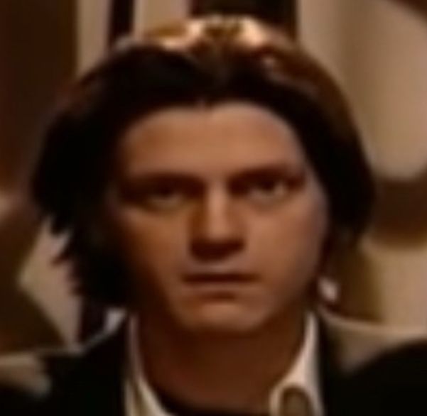 The prior image, only *further* zoomed in, showing just his face.