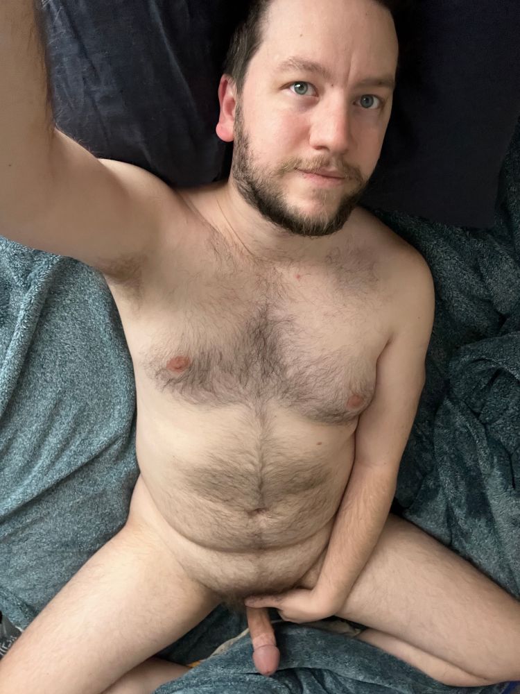 Zoomed-out selfie of me laying naked in bed, legs spread, morning wood on full display