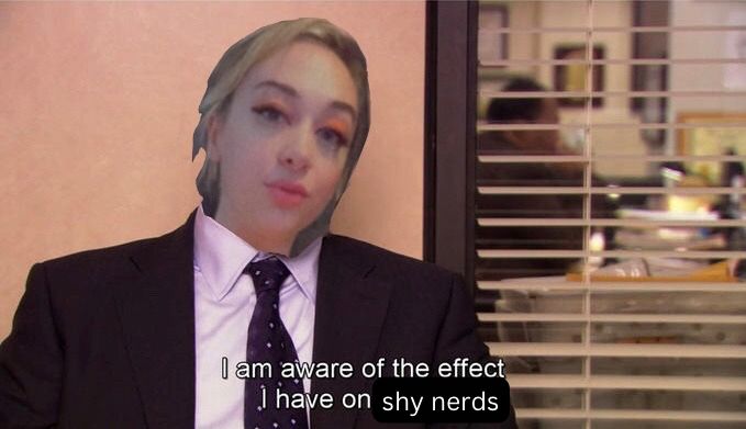 Delilah’s face on the body of Charles from the office with the text “I am aware of the effect I have on [shy nerds]”