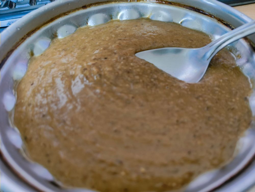 bowl of brown viscous liquid 