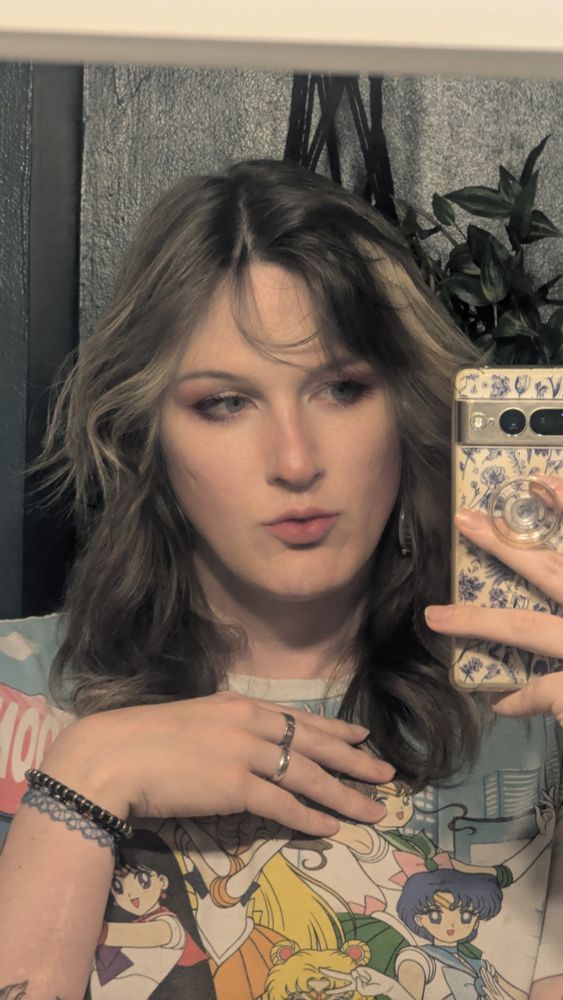 Layne in the mirror in a pajama shirt