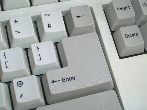 "Enter" key on a computer keyboard with twice the height of a normal key