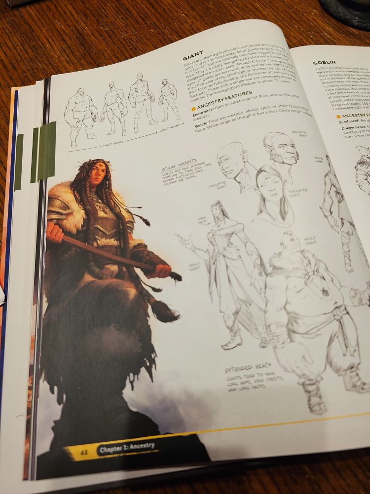 Inside pages of the Daggerheart core rulebook that show information and illustrations about the Giant ancestry. 