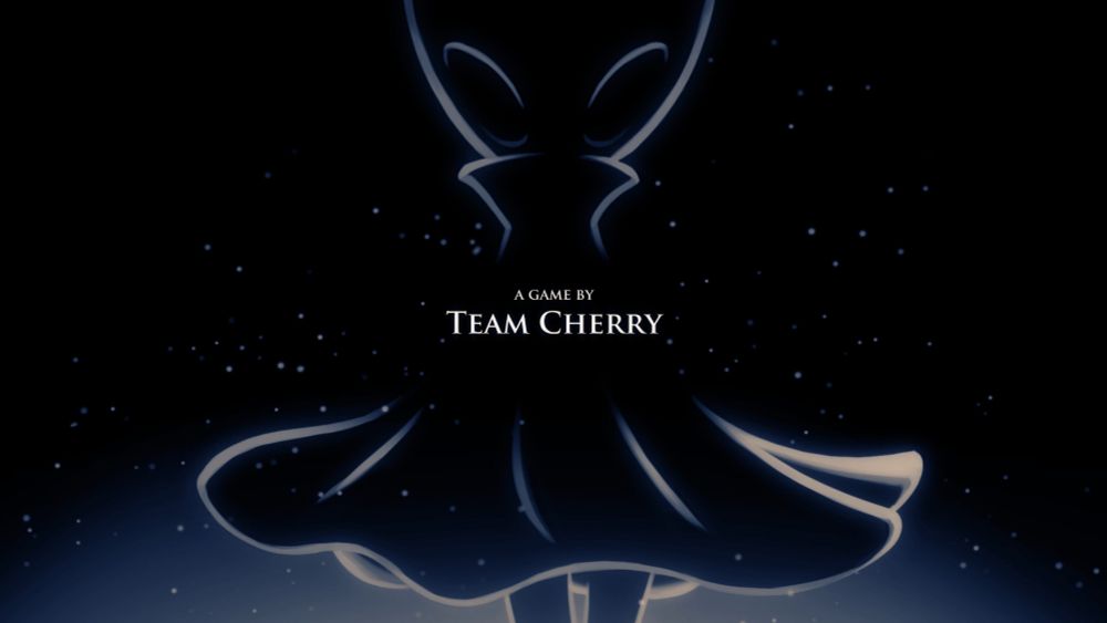 End title credits from Silksong - Hornet is silhouetted against a black background with the words "A game by Team Cherry".