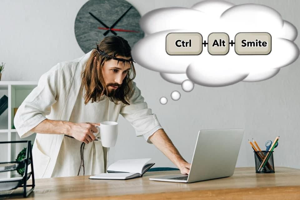 Jesus in white standing behind a desk, with a laptop and notebook and holding a cup. A thought cloud says Ctrl+Alt+Smite. 