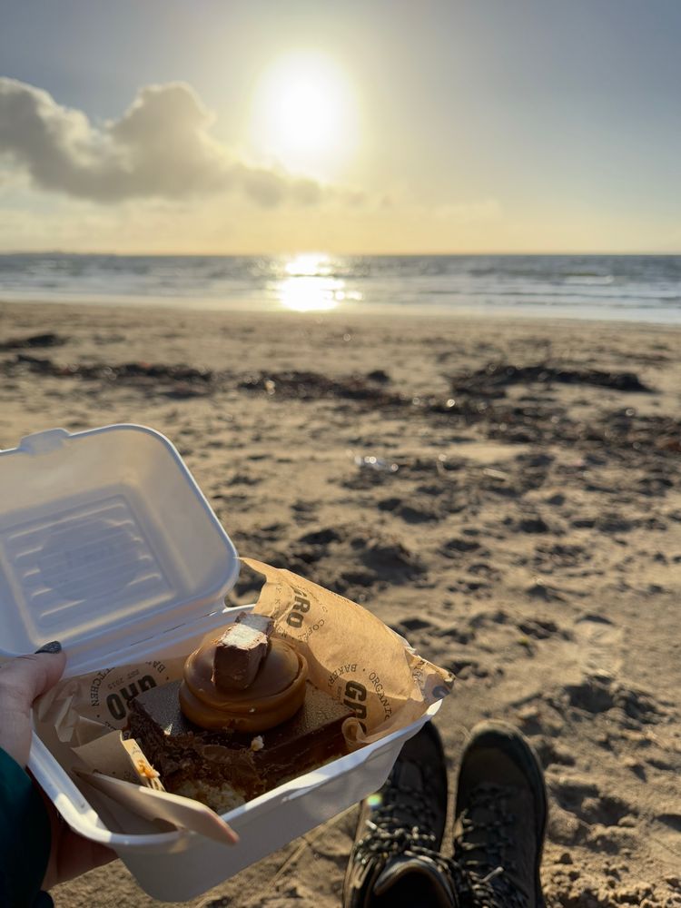 Gluten free coconut & caramel slice on the beach