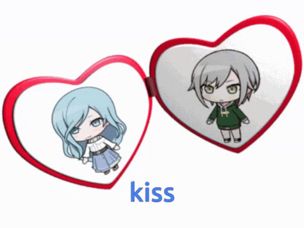 a couple of heart shaped mirrors with the word kiss underneath them