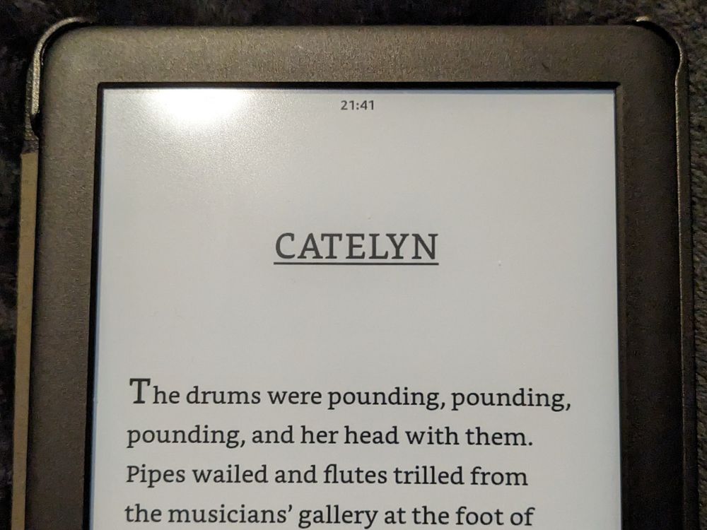 Photograph of a kindle displaying the opening paragraphs to a very particular Catelyn chapter in A Storm of Swords, of the A Song of Ice and Fire series.