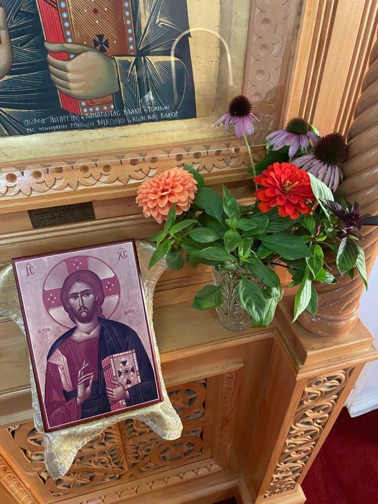 Jesus Christ iconography as high priest with lots of basil and flowers 
