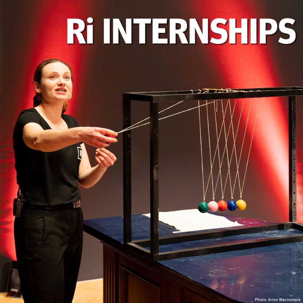 A woman in the Ri theatre about to activate a Newton's cradle with colourful balls. Text reads: Ri internships