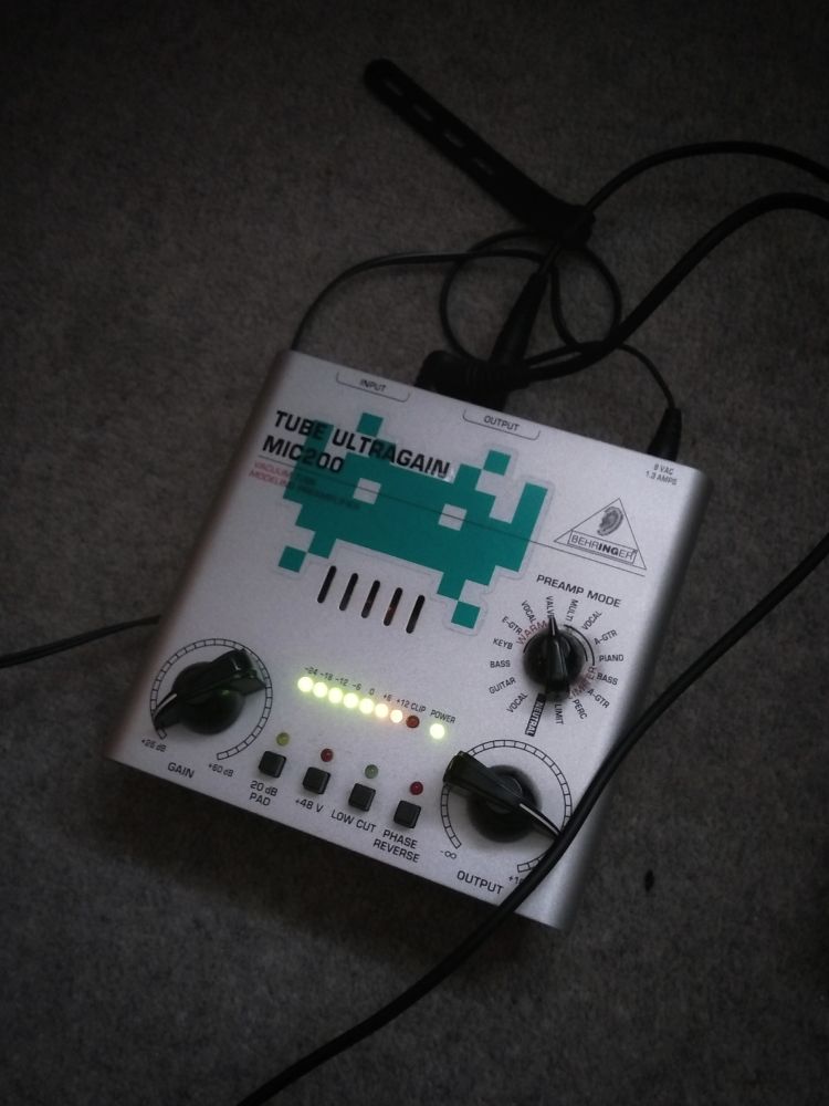 A Behringer tube ultragain pre-amp, with space invader decal.
