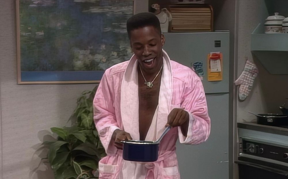 Dwayne Wayne in a pink robe 