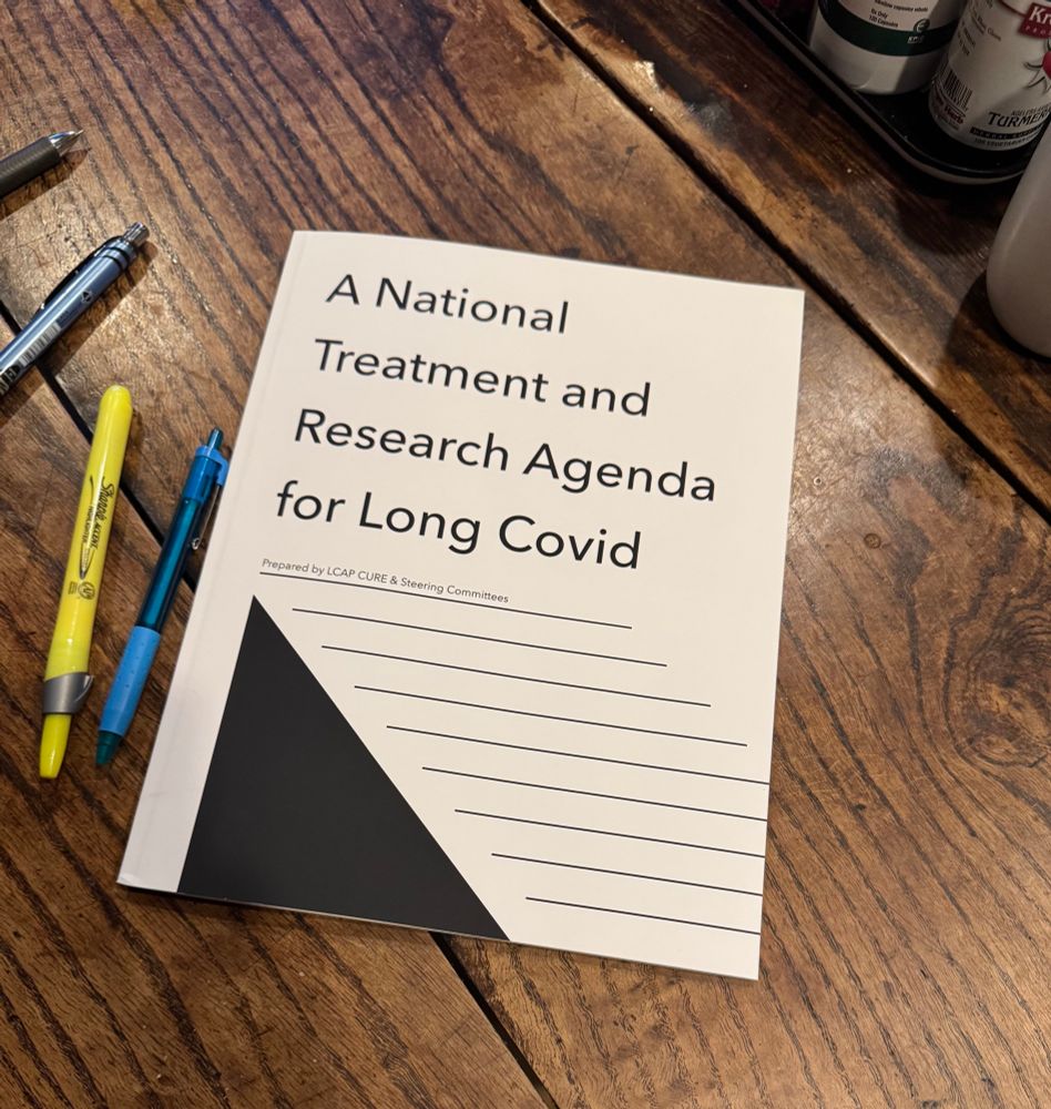 A copy of LCAP's book A National Treatment and Research Agenda for Long Covid on a table with pens.