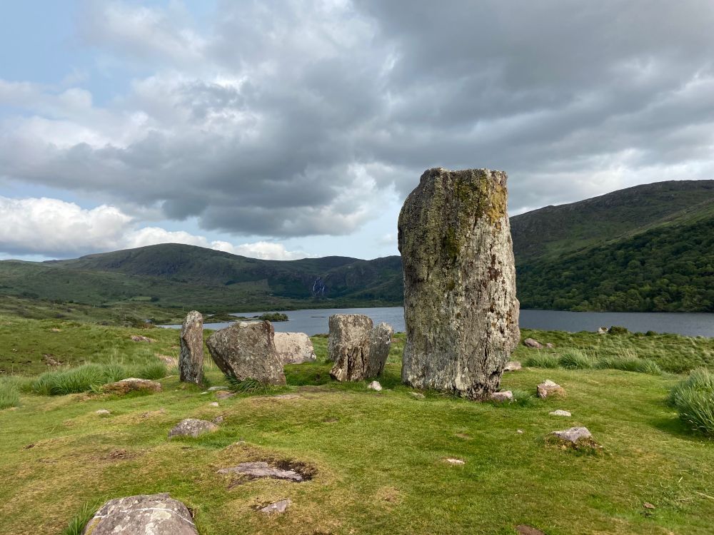 Ancient stone circle by a lake in Kerry, Ireland.