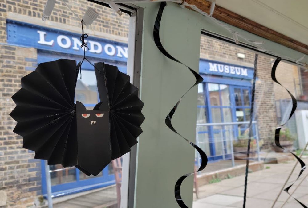 A paper Halloween bat on Long Tom