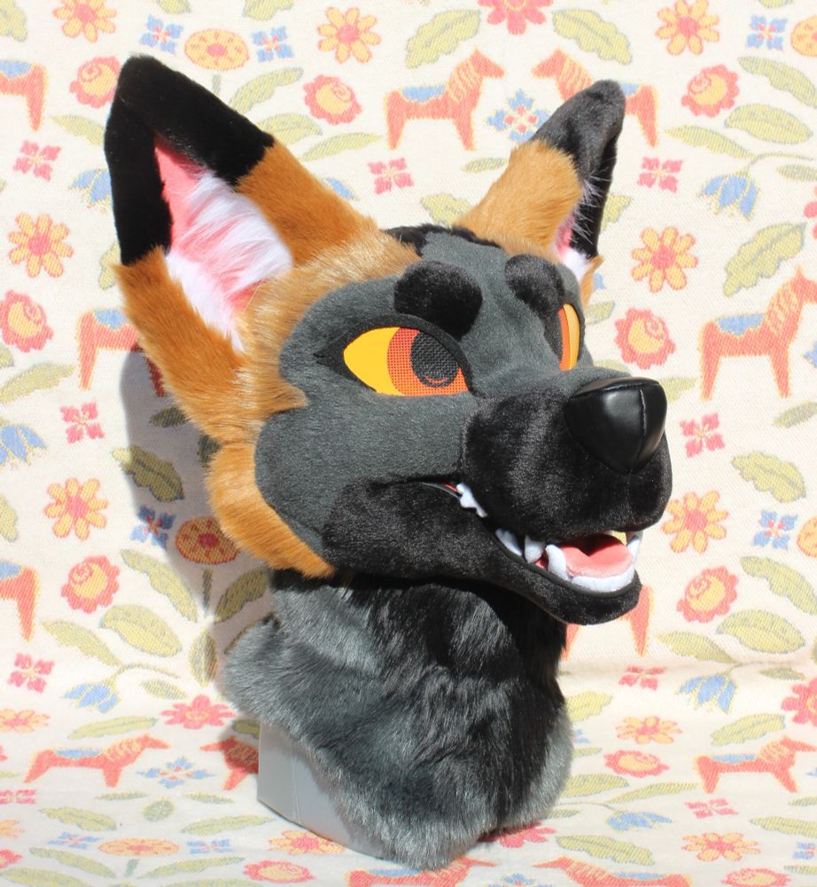 Cross fox fursuit head without the magnetic eyelids on.