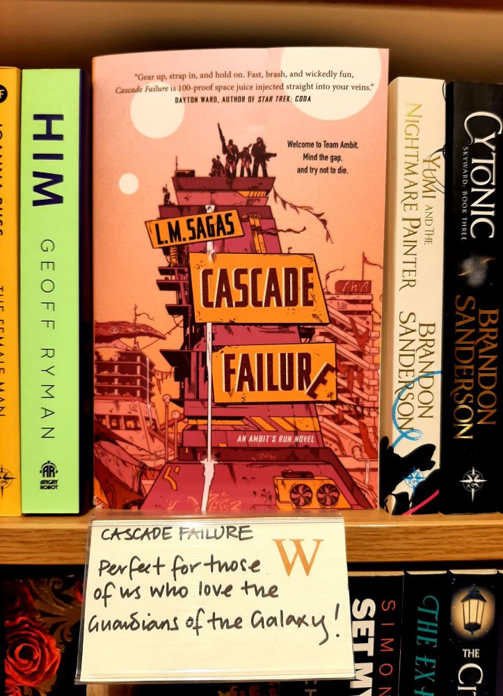A photo of the book on a bookshelf work a shelf talker review card below reading "Perfect for those of us who love Guardians of the galaxy"
