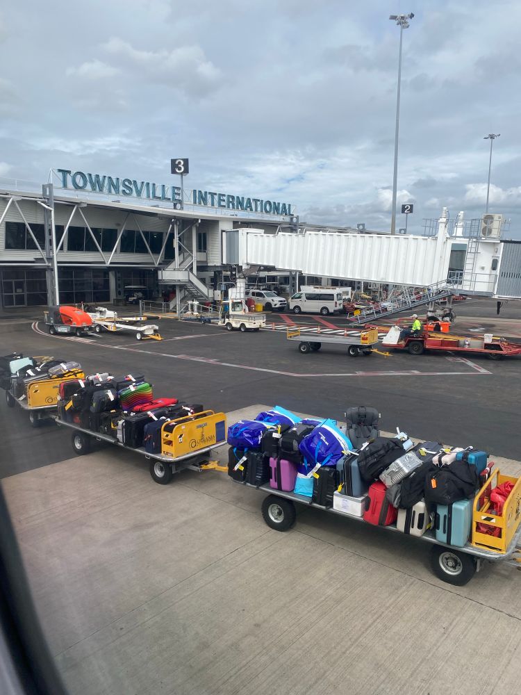 A picture of the tarmac from a plane window at Townsville International airport. 