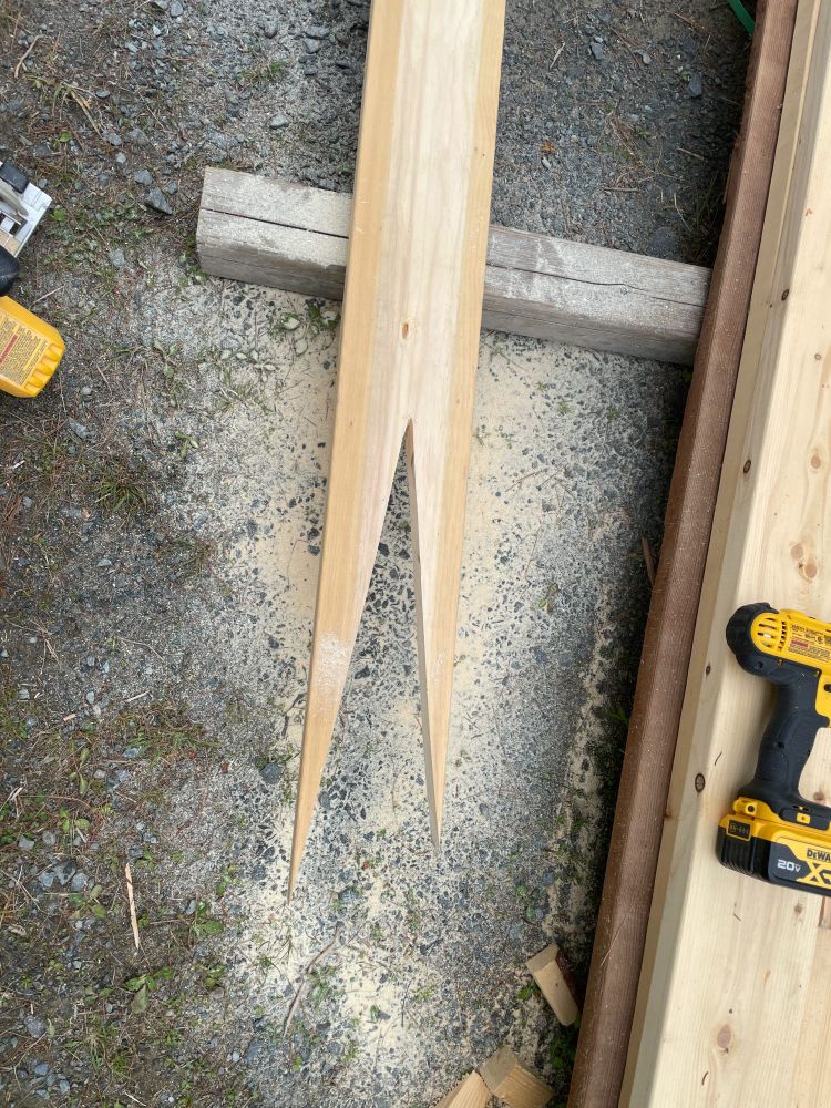 The bottom board has been cut through with the triangle removed.