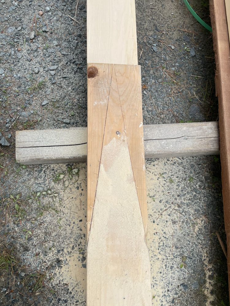 Overlapping boards with an 18" long triangle drawn/cut on the top board (the bottom board is also cut).