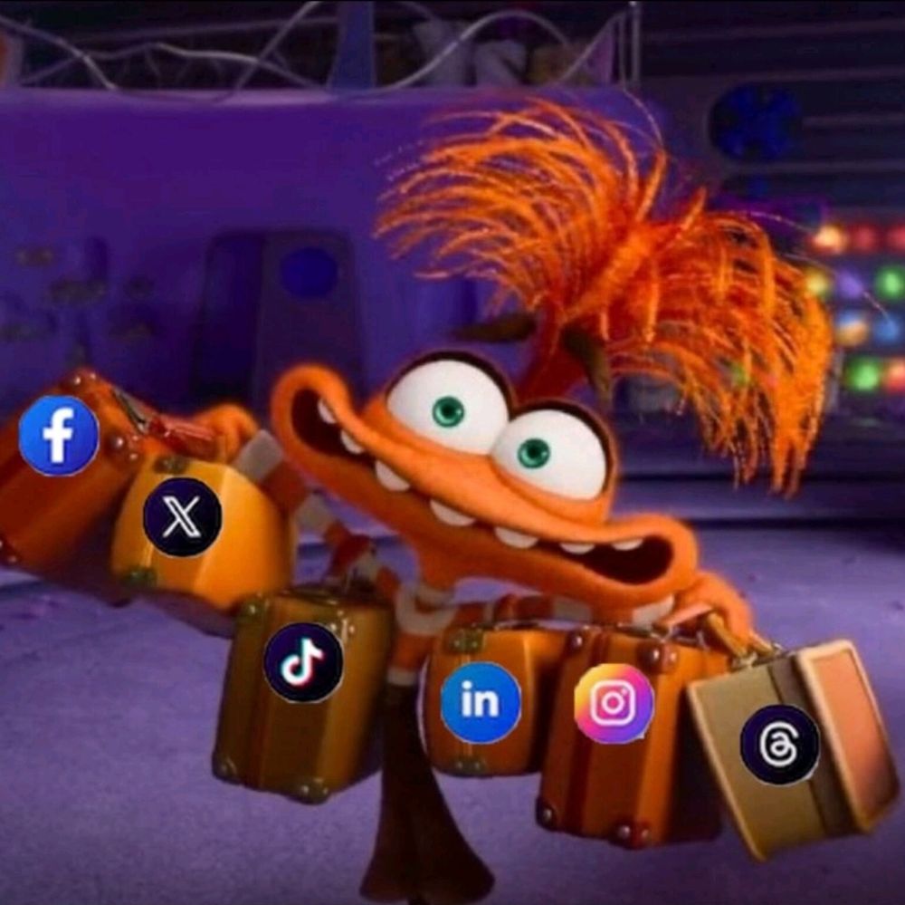 Anxiety from inside out holding up his many bags, each with a social media platform logo on them. 